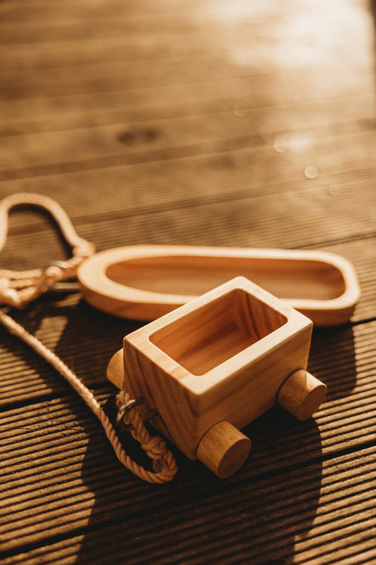 Wooden toy train on a wooden surface