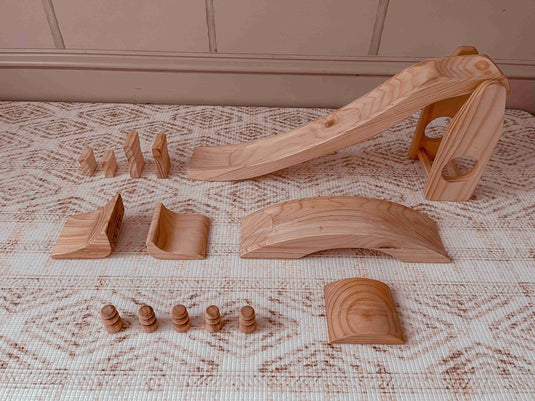 Set of wooden toys on a textured surface